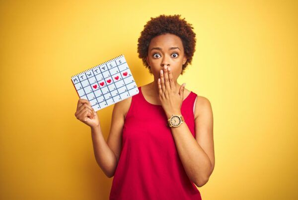 Woman holding menstruation calendar